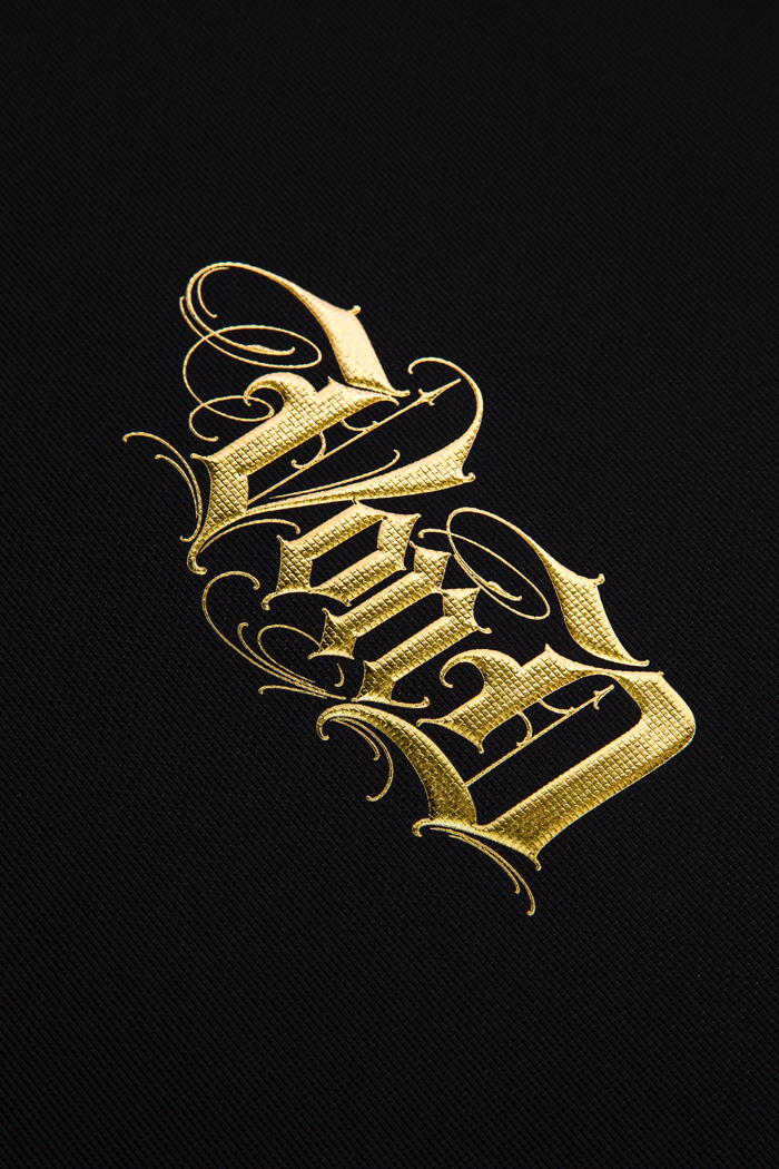 Textured paper with gold hot foil embossed logo