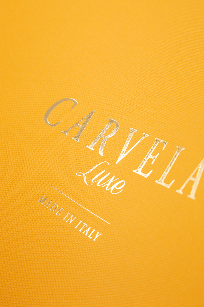Pulp colored textured paper with gold hot foil logo
